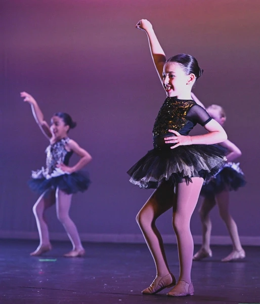 Young dancer performing on stage