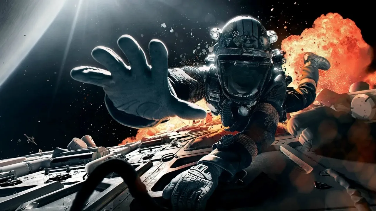 An astronaut in a space suit reaches out dramatically while floating away from a bursting spacecraft, surrounded by a backdrop of stars and space debris against the darkness of space.