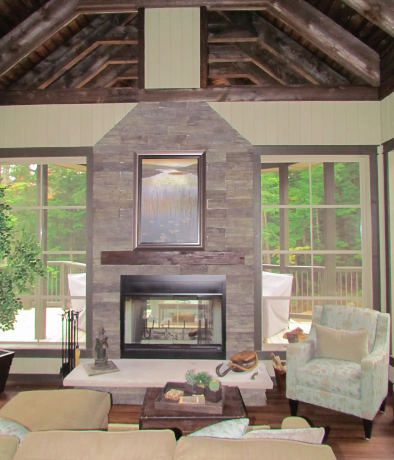 a luxury interior of a high end haliburton cottage with custom finishes and custom stone fireplace.