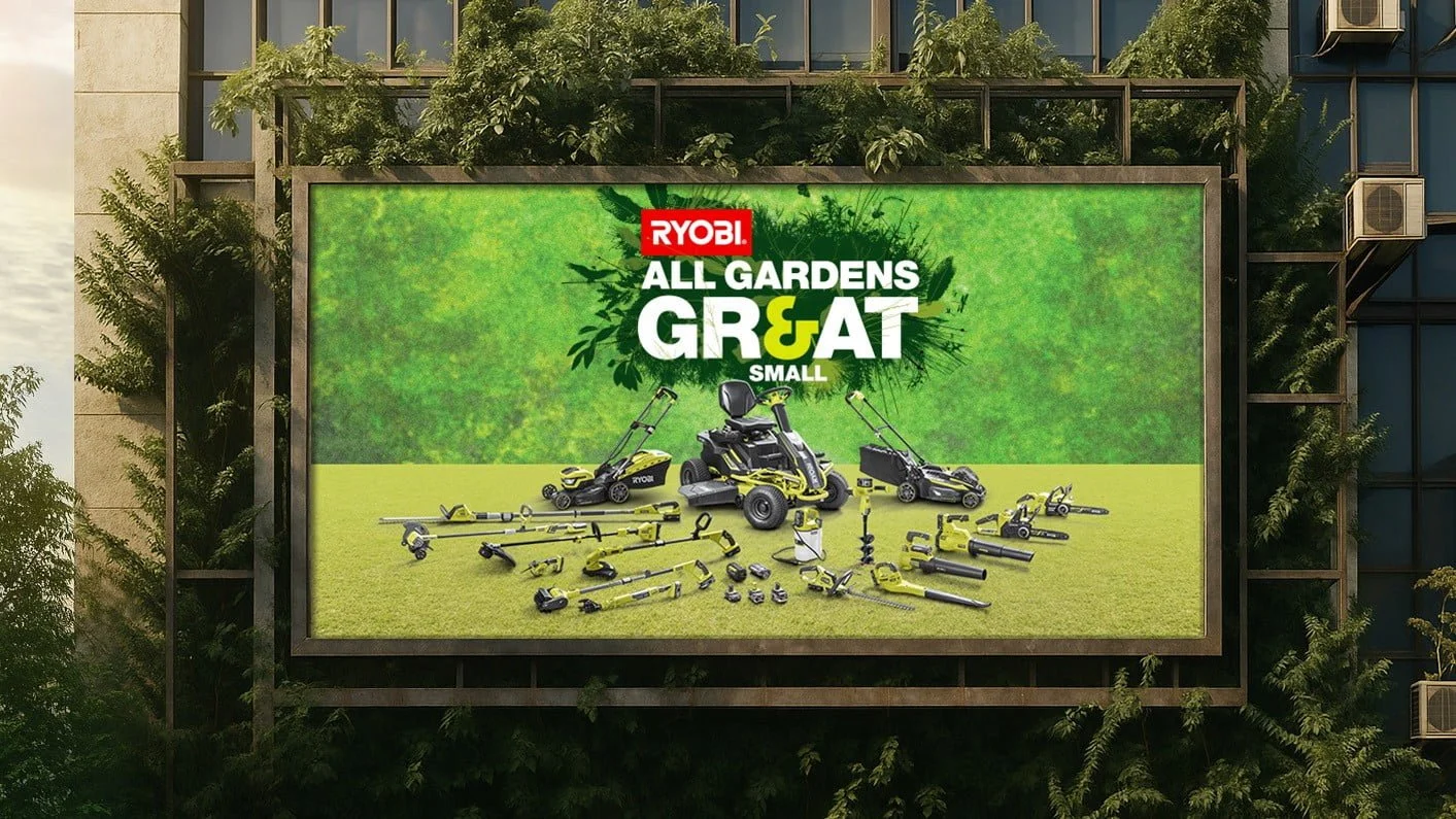 Ryobi outdoor screen 'All Gardens Great & Small' with mowers and cordless tools on a building covered in greenery