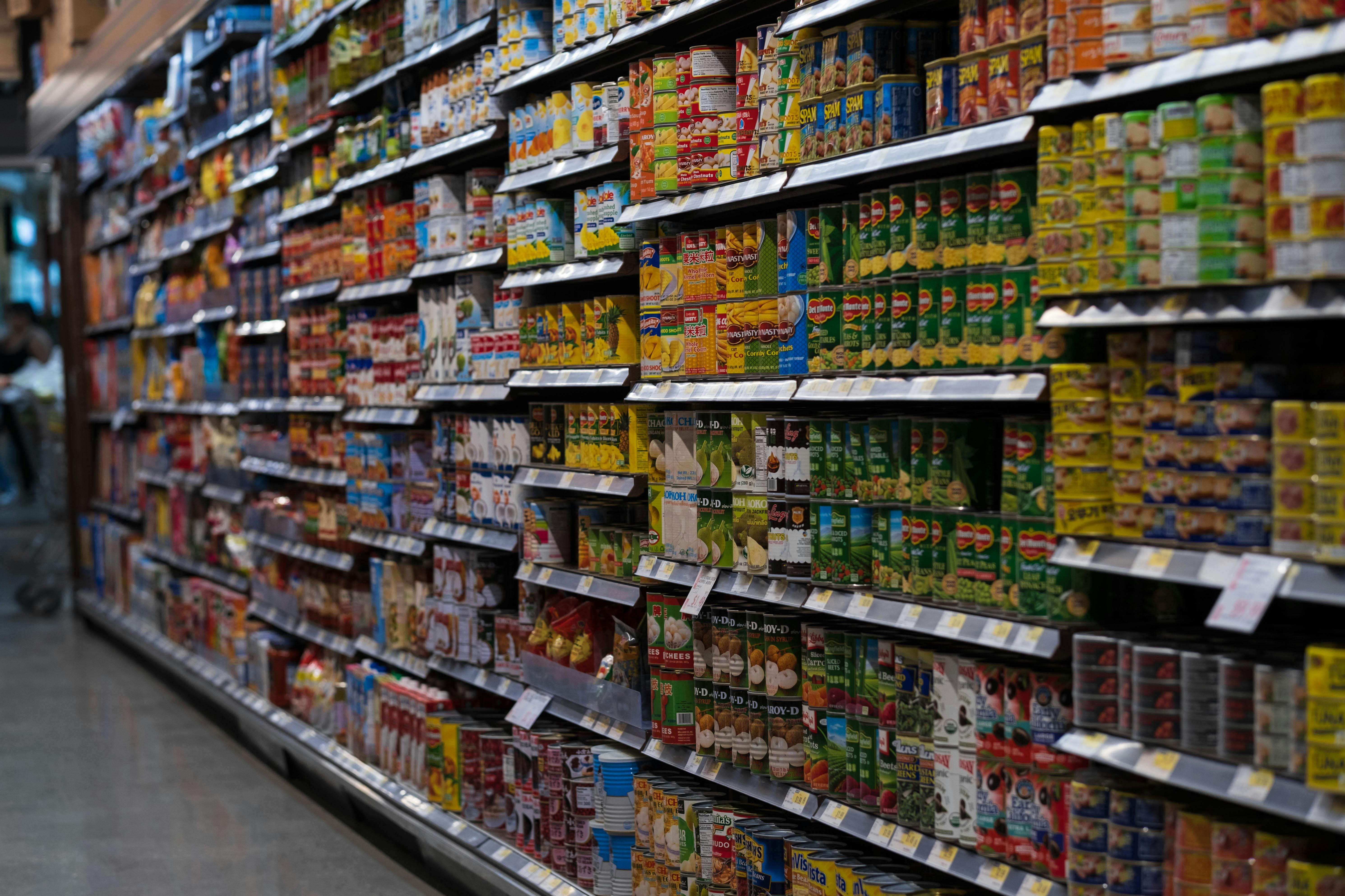 Grocery store aisle filled with shelves of packaged food products