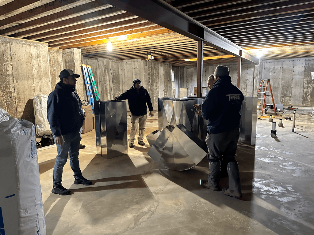 workers installng ductwork