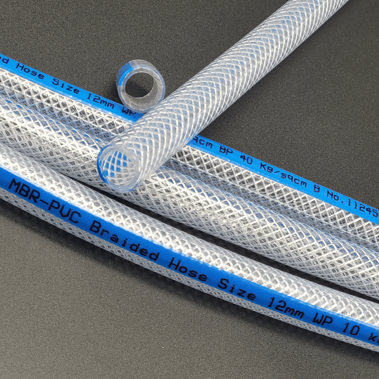 PVC Braided hose with blue stripe, placed on black background