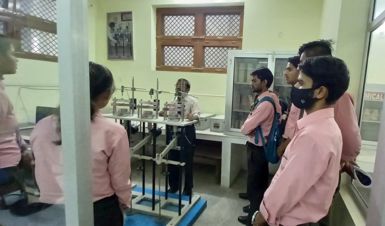 Full moon rising behind a house at night