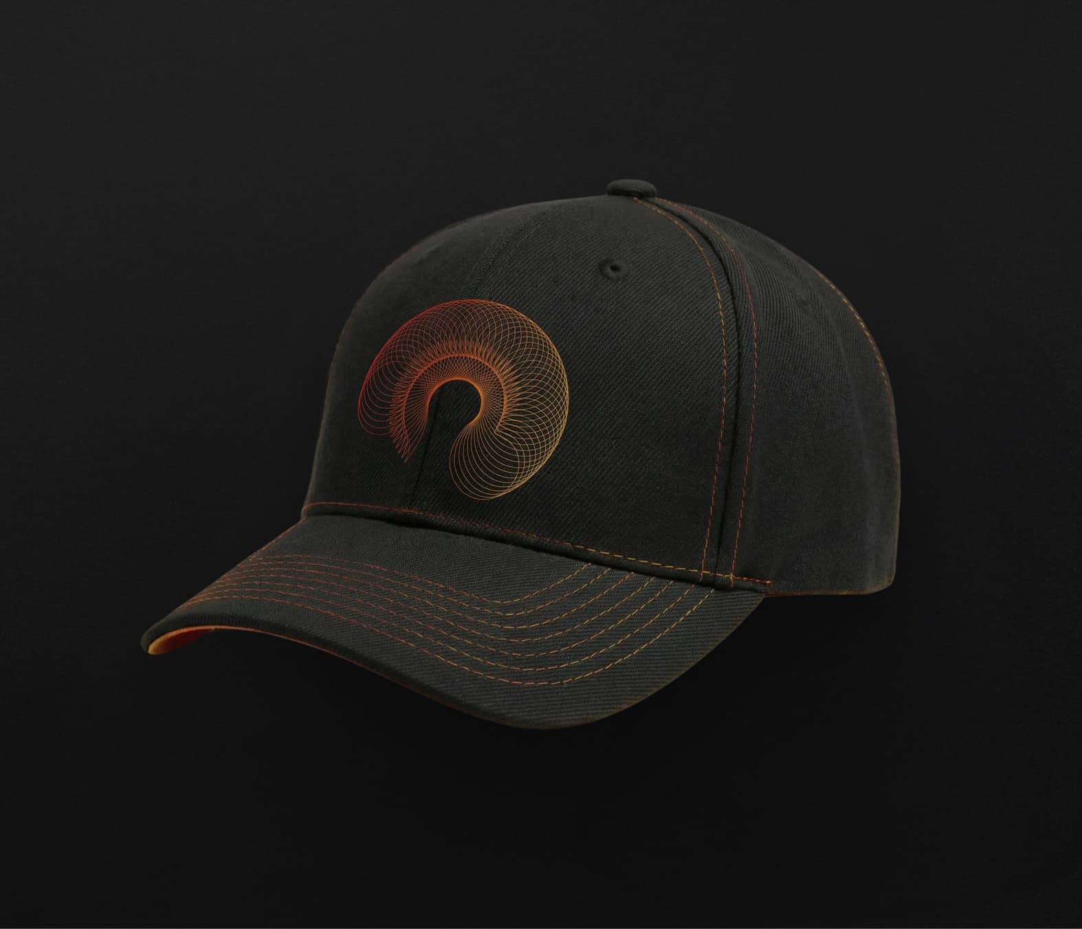 Black baseball cap featuring an embroidered orange abstract spiral logo on the front, part of the corporate merchandise kit.