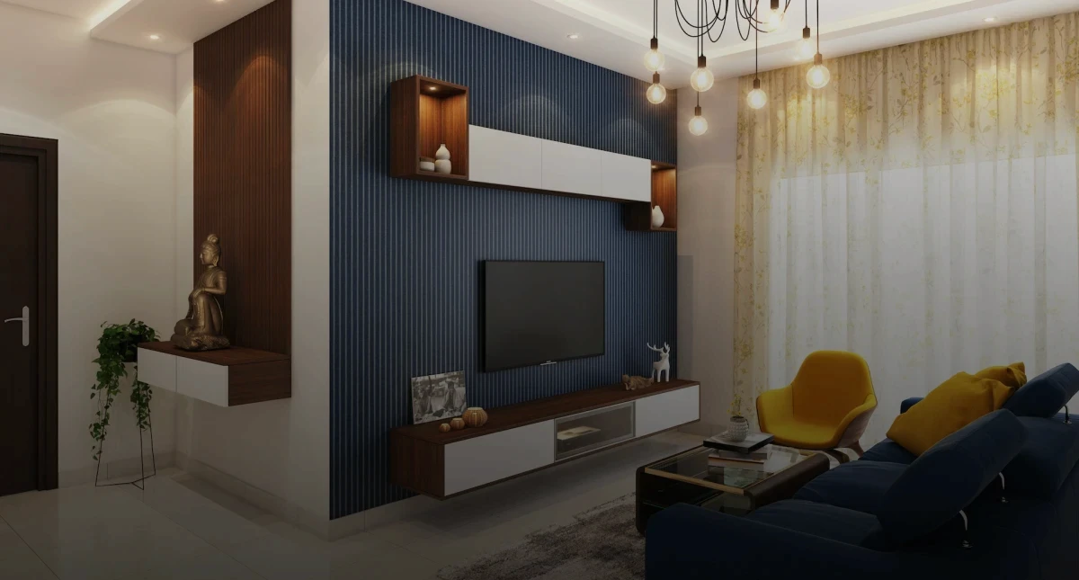 imagem de uma sala de apartamento projetada cuidadosamente com elegância e sofisticação. A imagem mostra uma parte da porta de entrada e da sala de estar com sofá, televisão e uma mesa de centro.