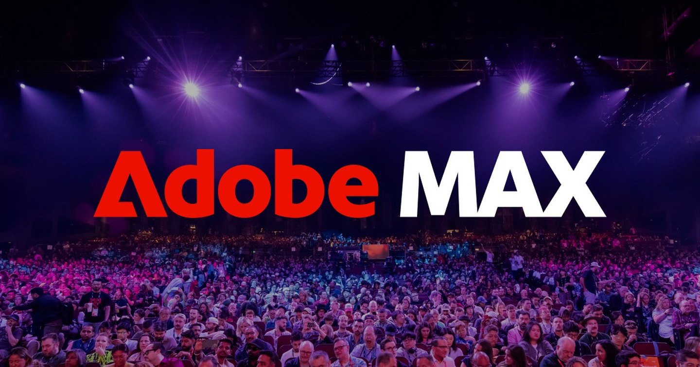 Adobe MAX logo over a packed keynote hall lit in purple