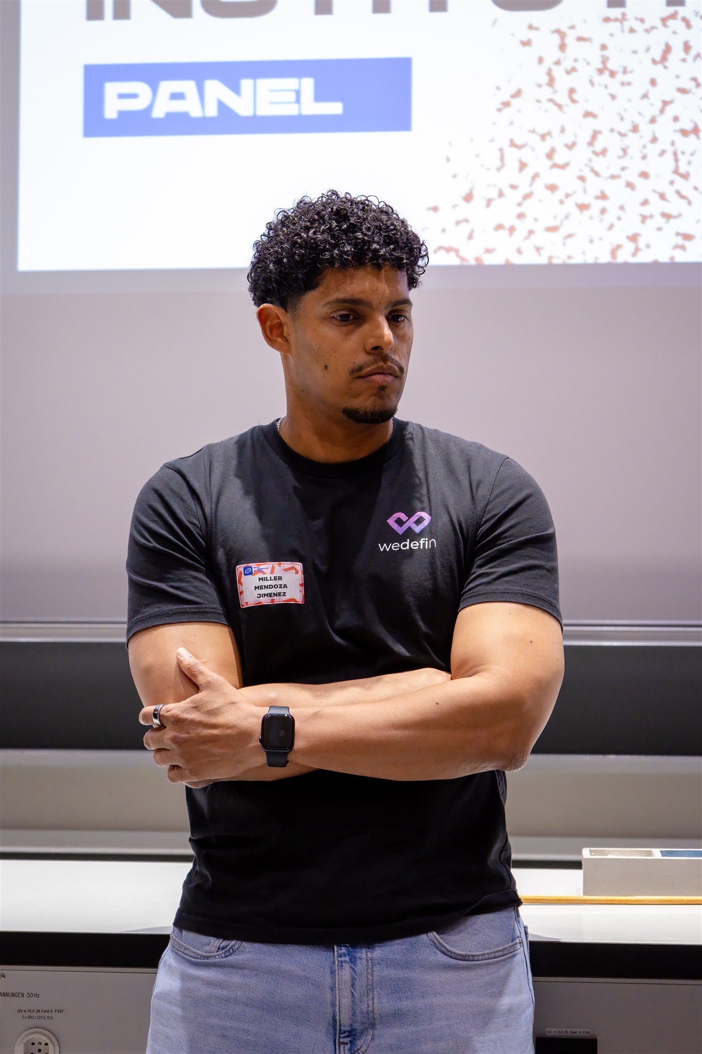 Panel speaker listening during EthereumZüri conference in Zurich