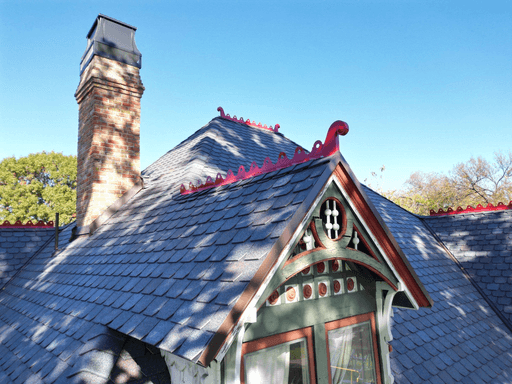 Close-up synthetic slate roofing detail Dallas historic home restoration with decorative ridge caps
