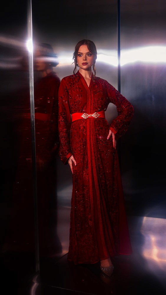 Crimson Moroccan caftan with rich handcrafted detailing, luxury evening wear designed for Bahrain and Gulf clients