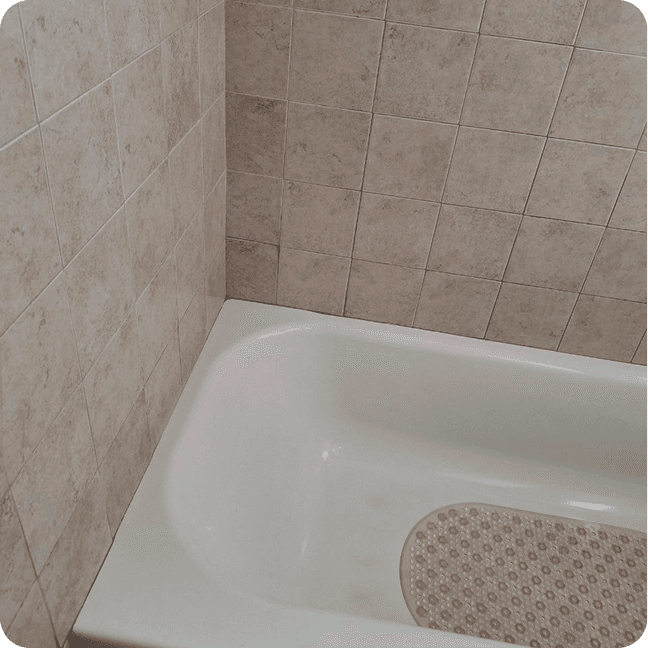 A bath after cleaning in the bathroom with tiles