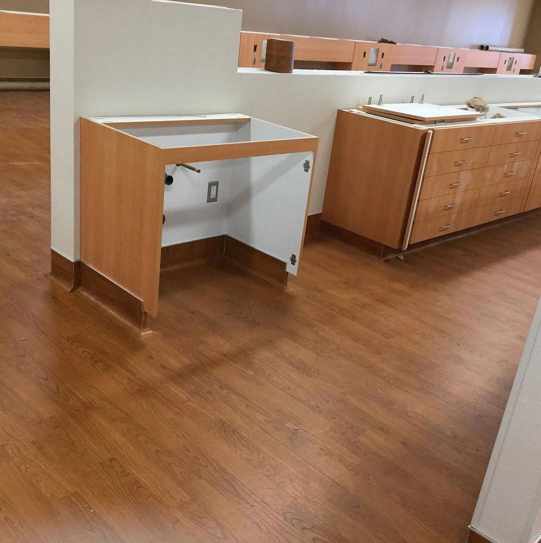 Sheet vinyl cut in tight to the base of clinic casework