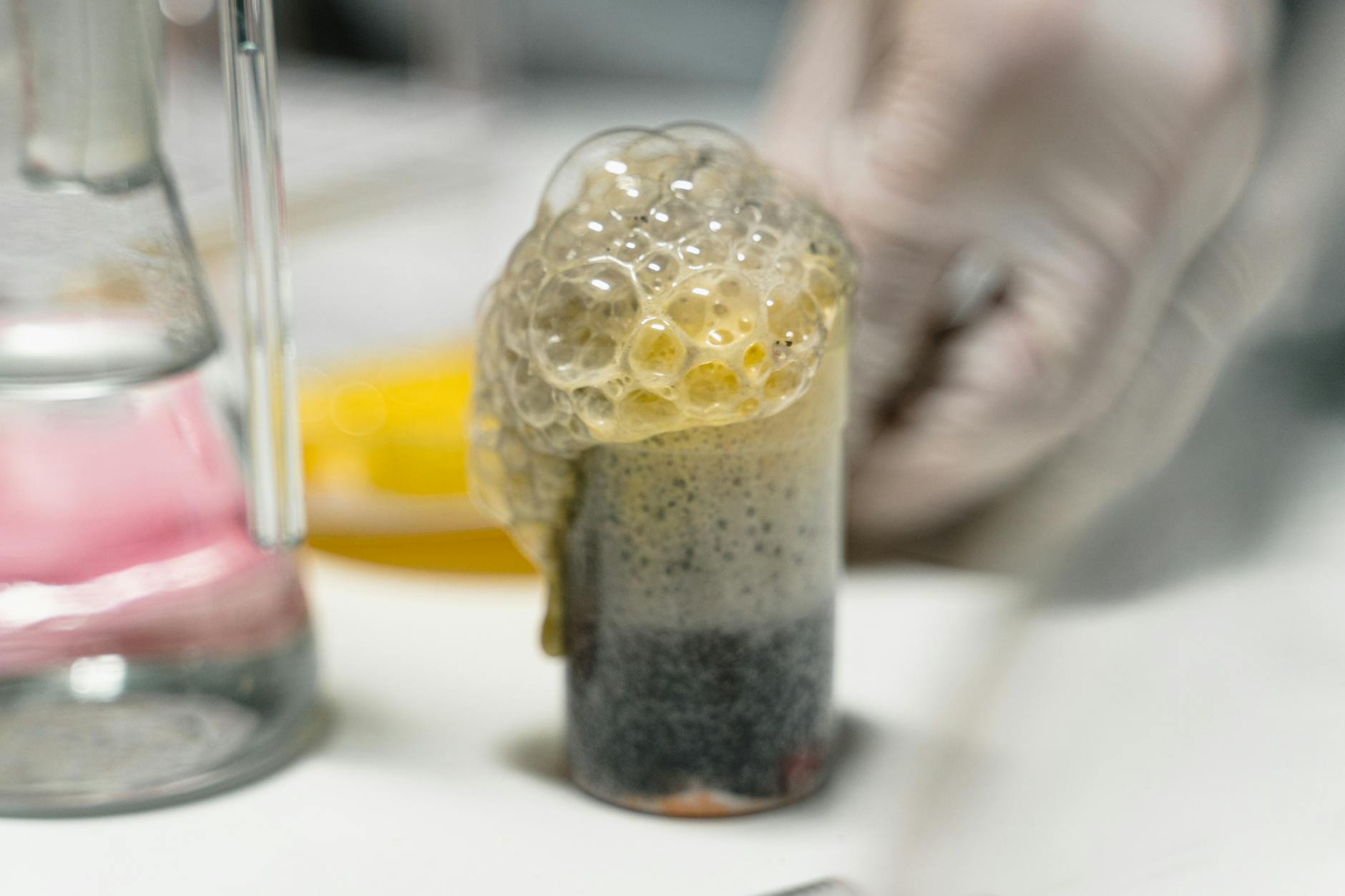 An enthusiastic science teacher guides students through a hands-on physics experiment using a pendulum.