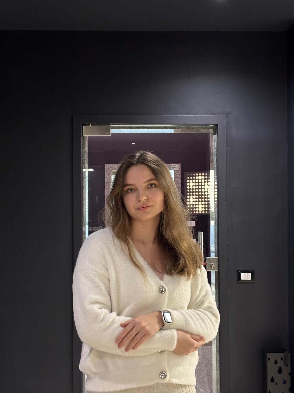 man self portrait wearing gray and white collared button-up shirt near green leaf plant with white ceramic pot