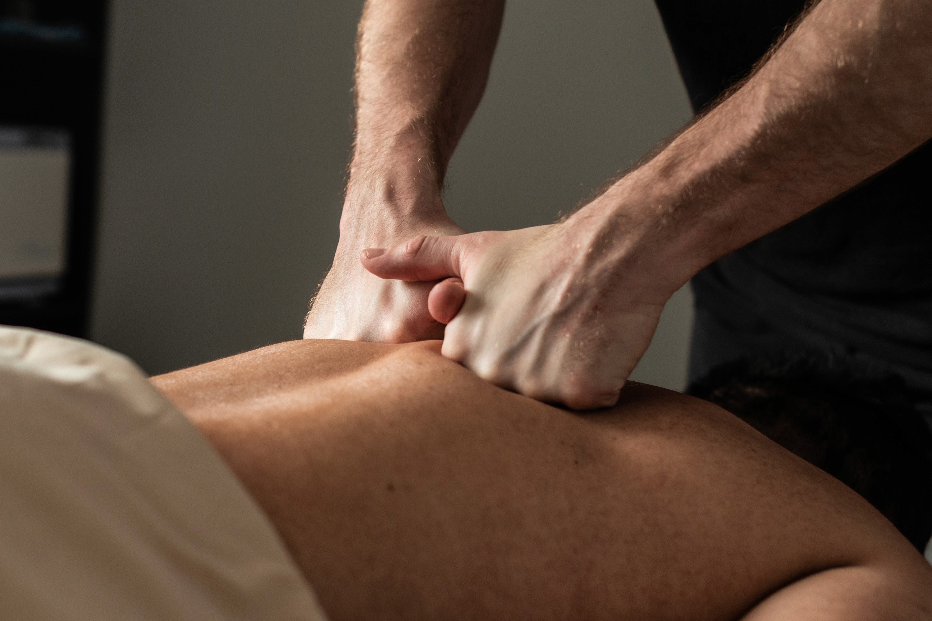 Person recieving massage therapies on neck