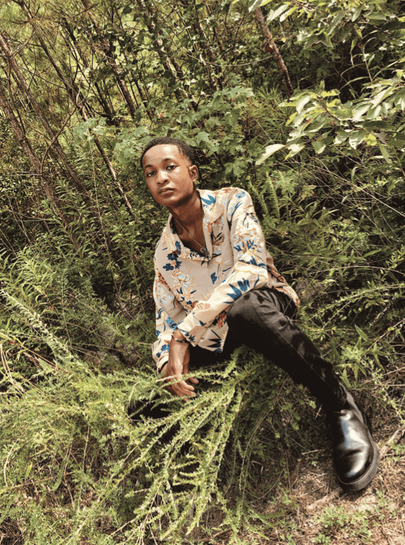 a group of people walking on a sidewalk