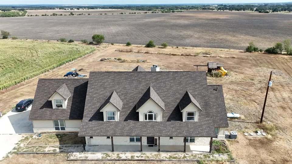 Finished front view of the Hondo home with GAF Timberline HDZ shingles in Chestnut Valley, September 2026.