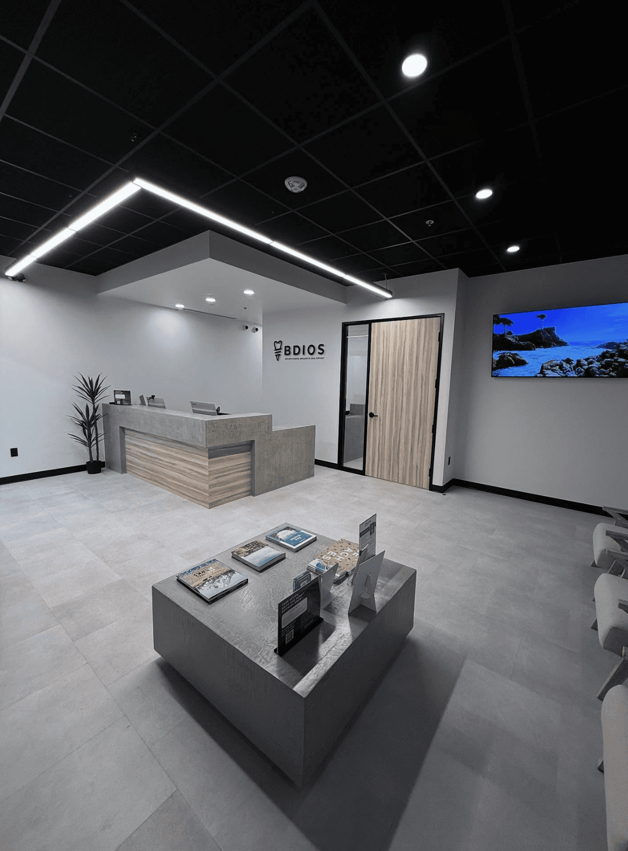 Modern dental clinic reception interior with custom logo sign