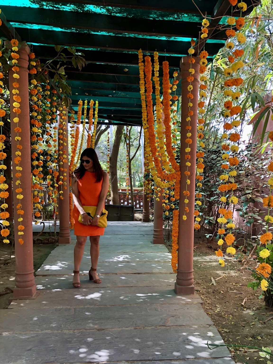 Pranjali framed by a walkway with hanging garlands. Photograph by Pranjali Shah.