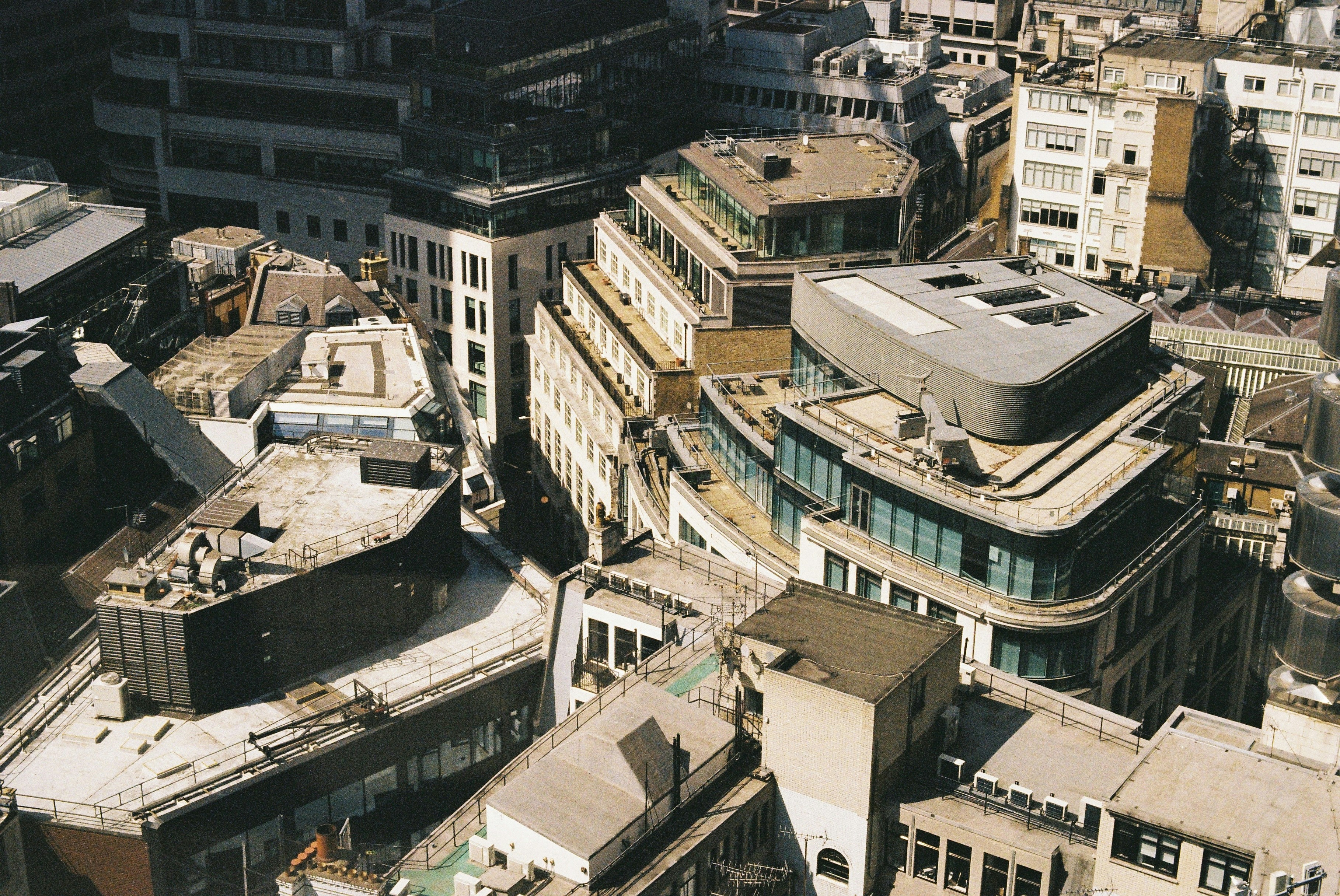 Aerial view of modern city buildings and rooftops