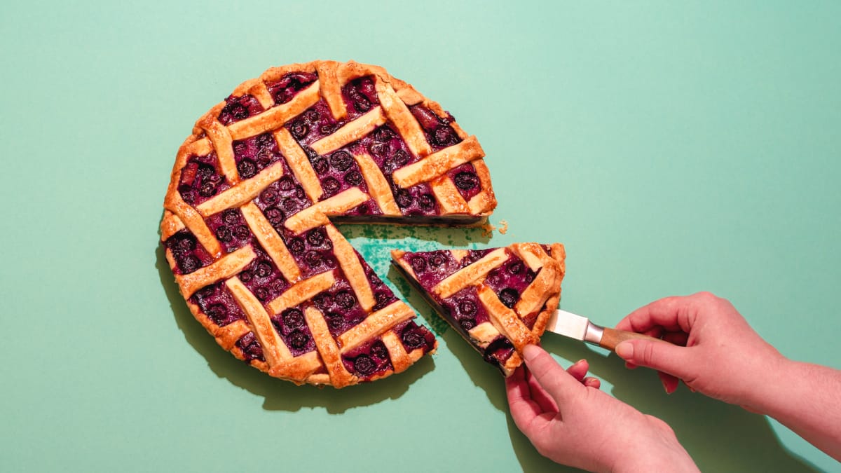 Person taking a piec of pie