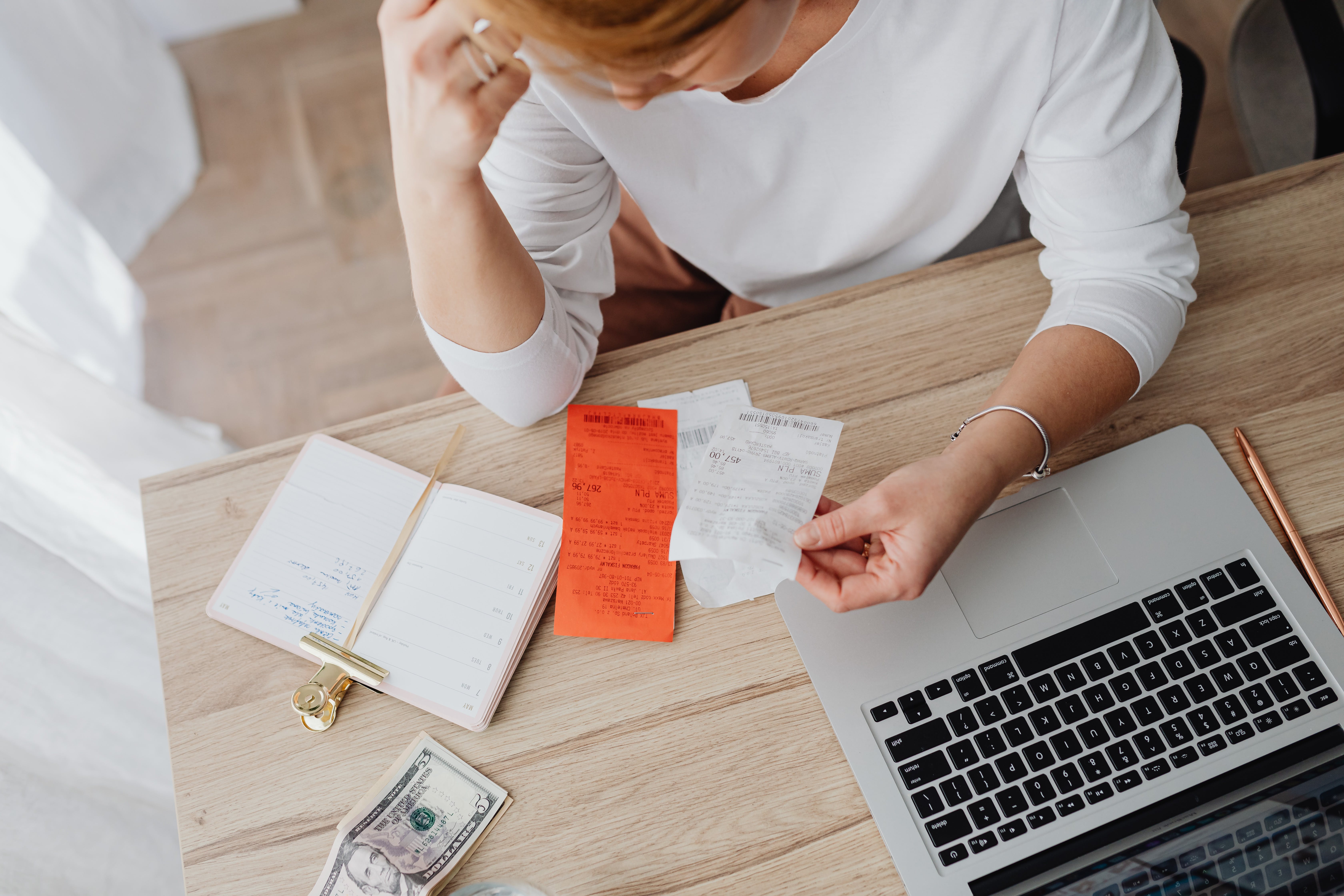 Woman checking her receipts with inflation rising