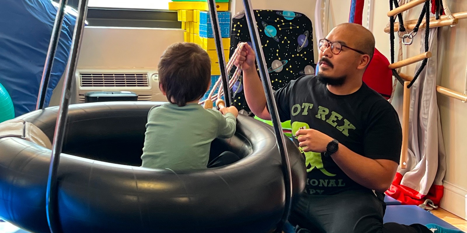 Therapist Joseph Homer Inoferio working with a patient