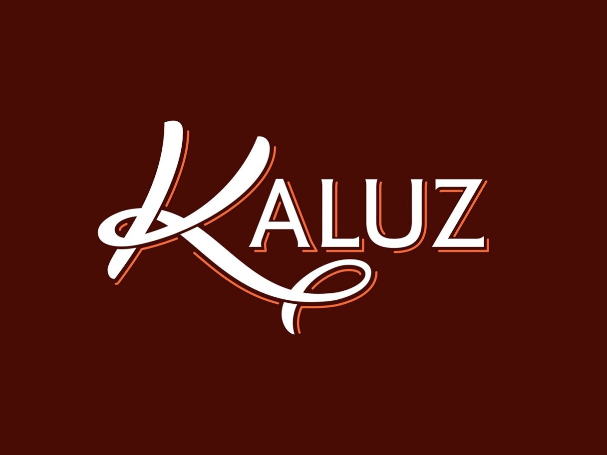 Rustic cabin in a golden field at sunset