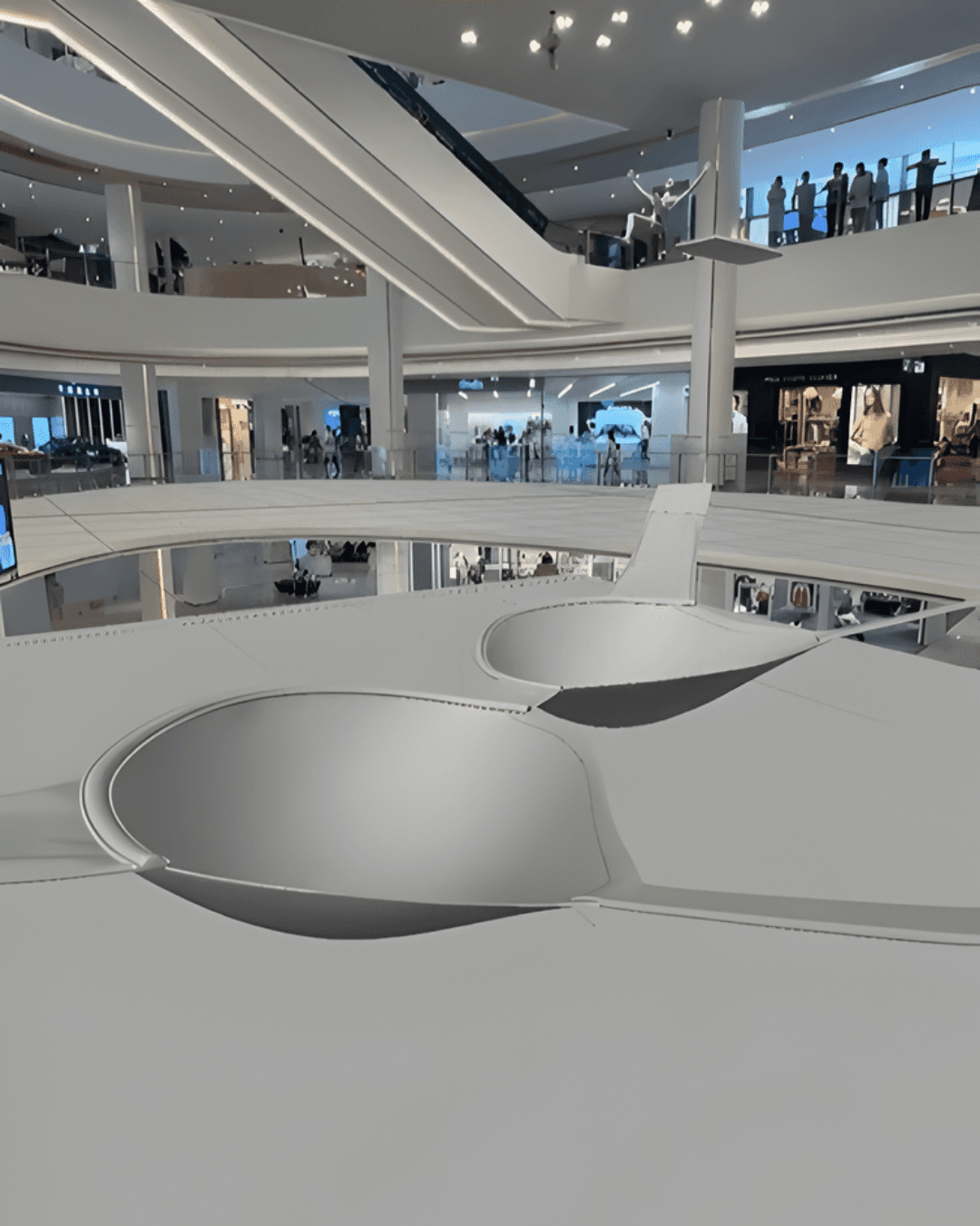 A technical 3D wireframe overlay maps the scale and positioning of the SKIMS asset within the mall's architecture
