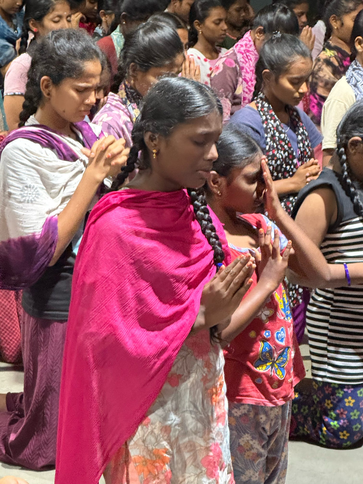 Indian Lady praying on knees