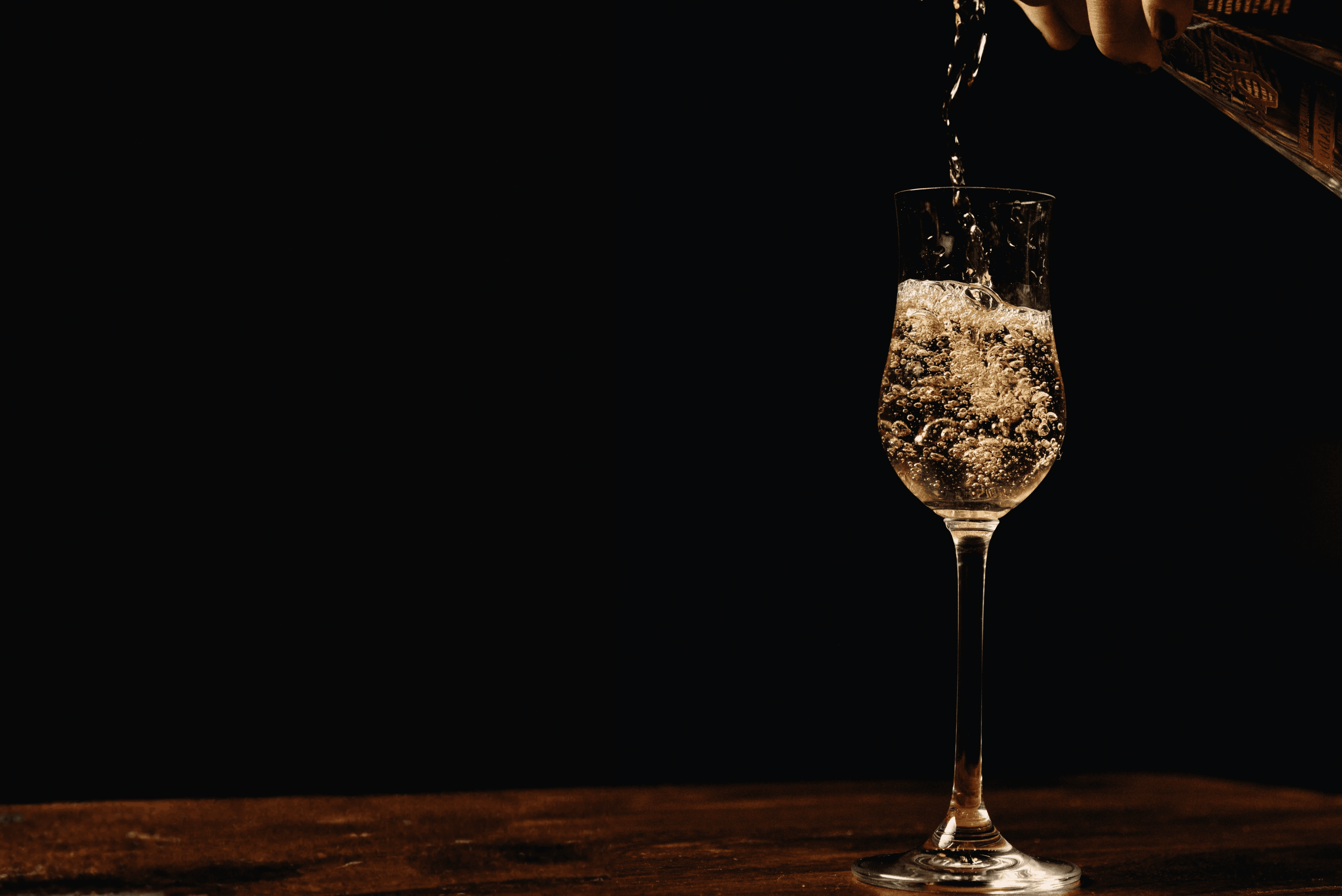 a couple of bottles sitting on top of a wooden table
