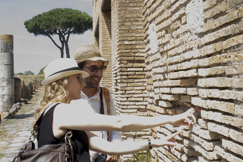 man and woman touching the wall