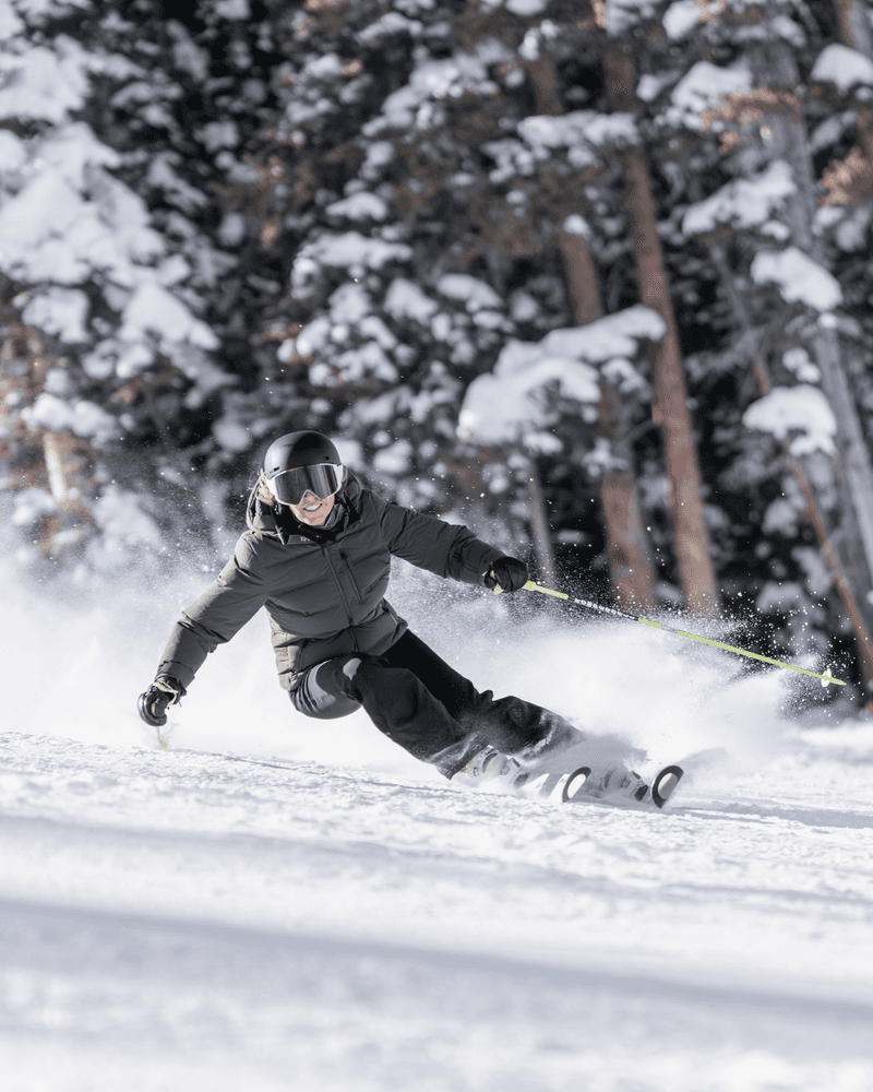 Skier making a turn in Aspen snow