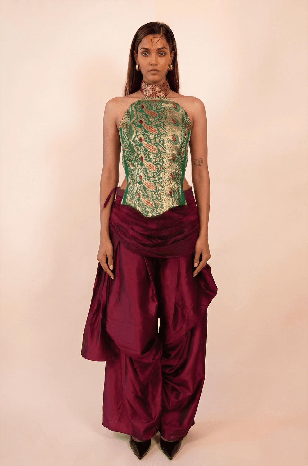 Apsara is our high-neck, backless top crafted from a vintage silk saree, inhouse by skilled artisans.
