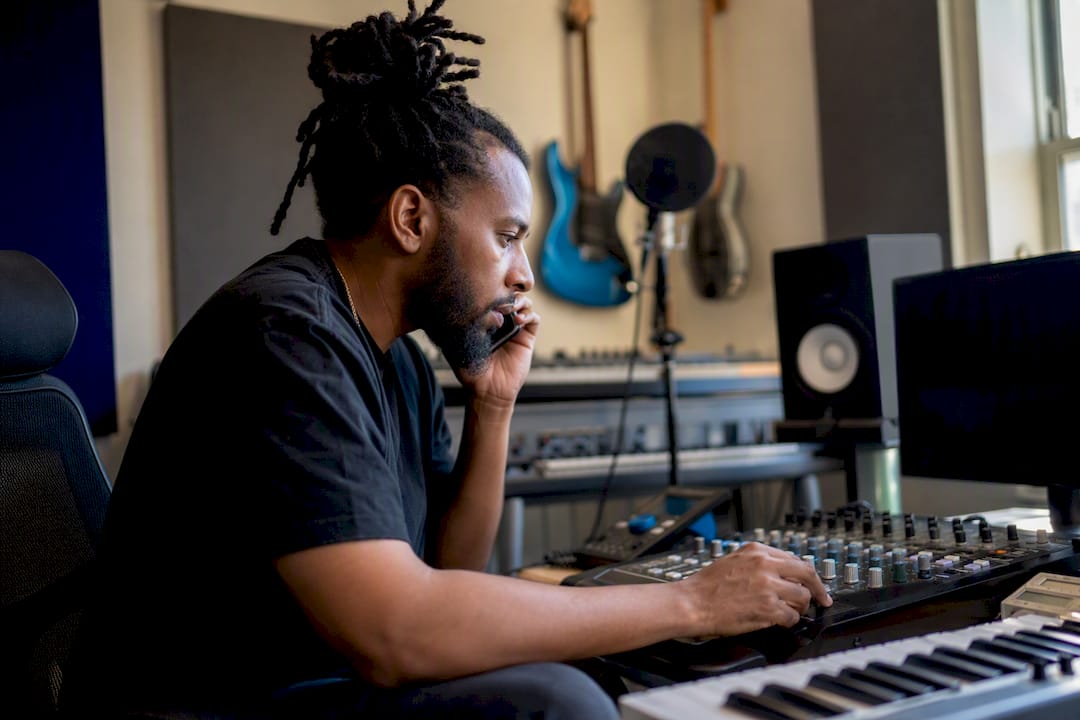 Music producer negotiating license on phone