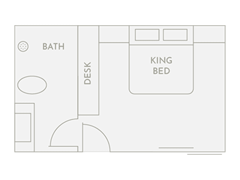 Floor plan of Room 1 at Club Vieques, showcasing the king bed, desk, mini-fridge, and bathroom layout.