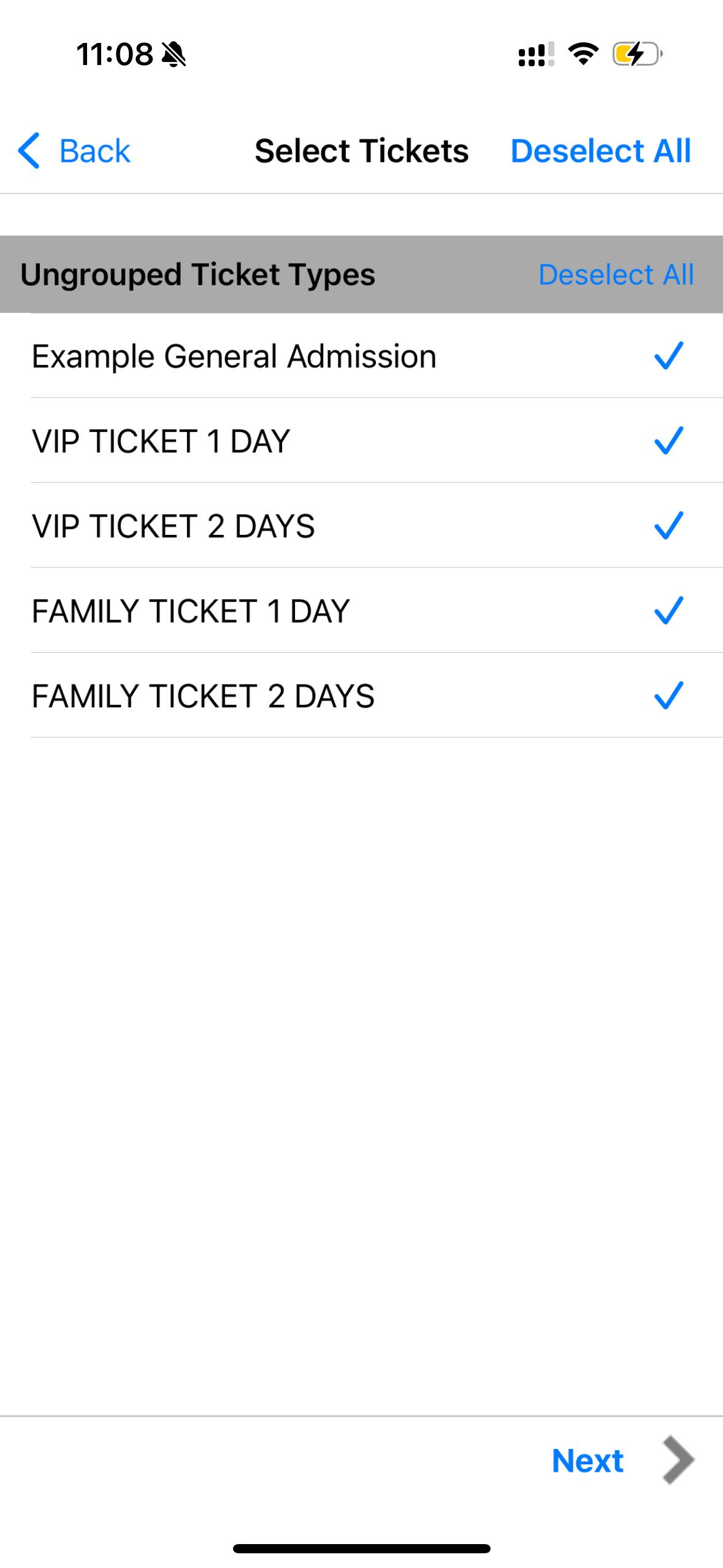 a hand holding a black device