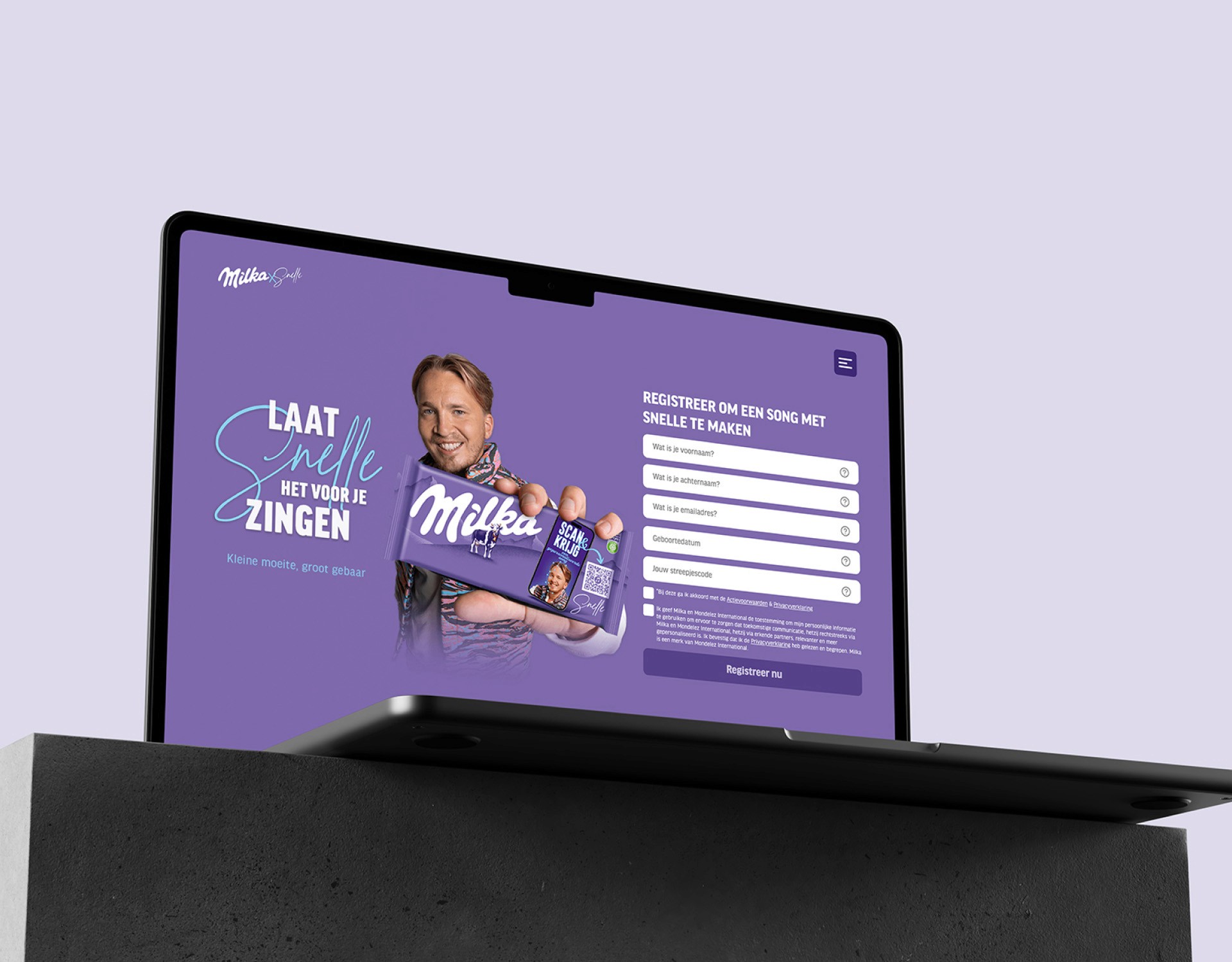 man wearing grey t-shirt standing in front of man sitting on chair