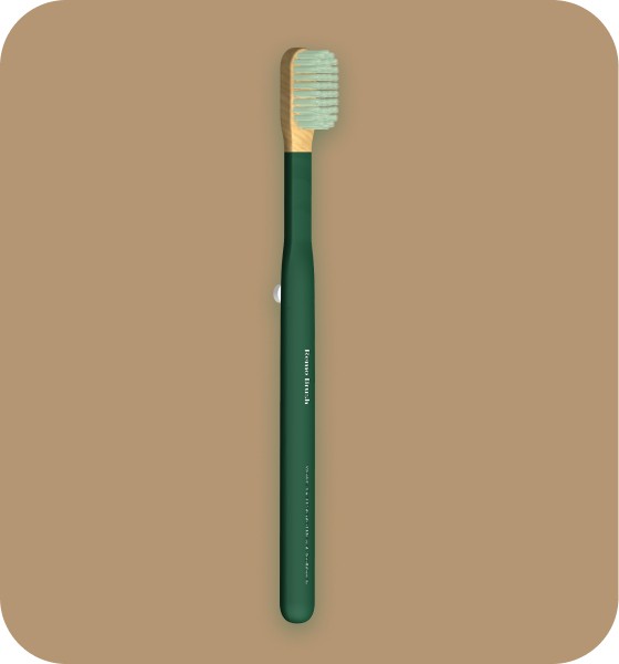 The RemoBrush toothbrush, featuring a sustainable wooden handle and light green bristles, is shown inside its dark green travel case. This image highlights the eco-friendly design and packaging created by The Editor Suite.