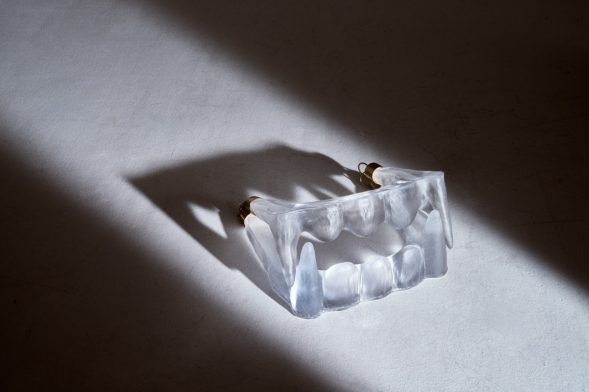 Matilda Kästel glass art — cast glass object in studio light
