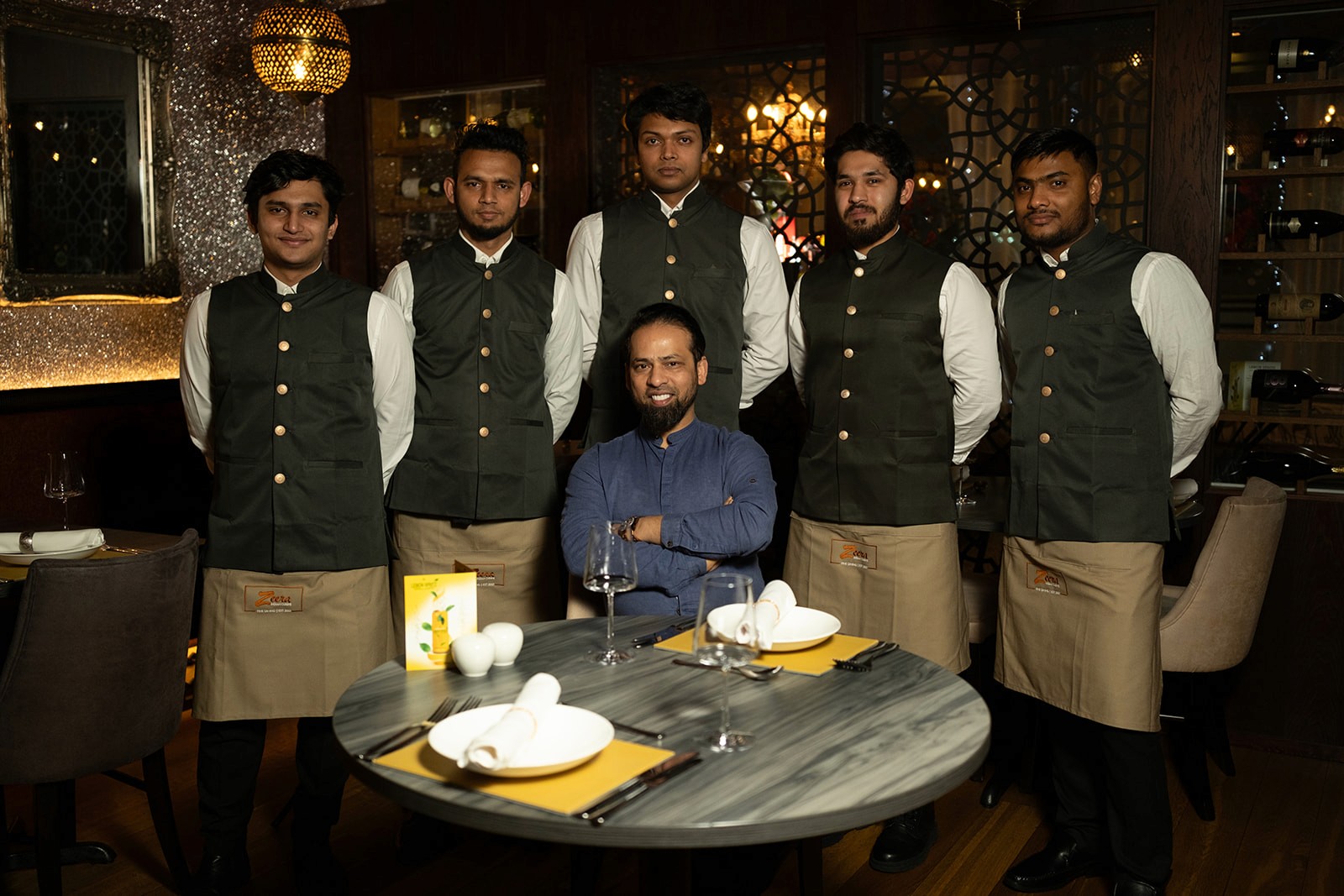 A person stands in a sandstone cave.