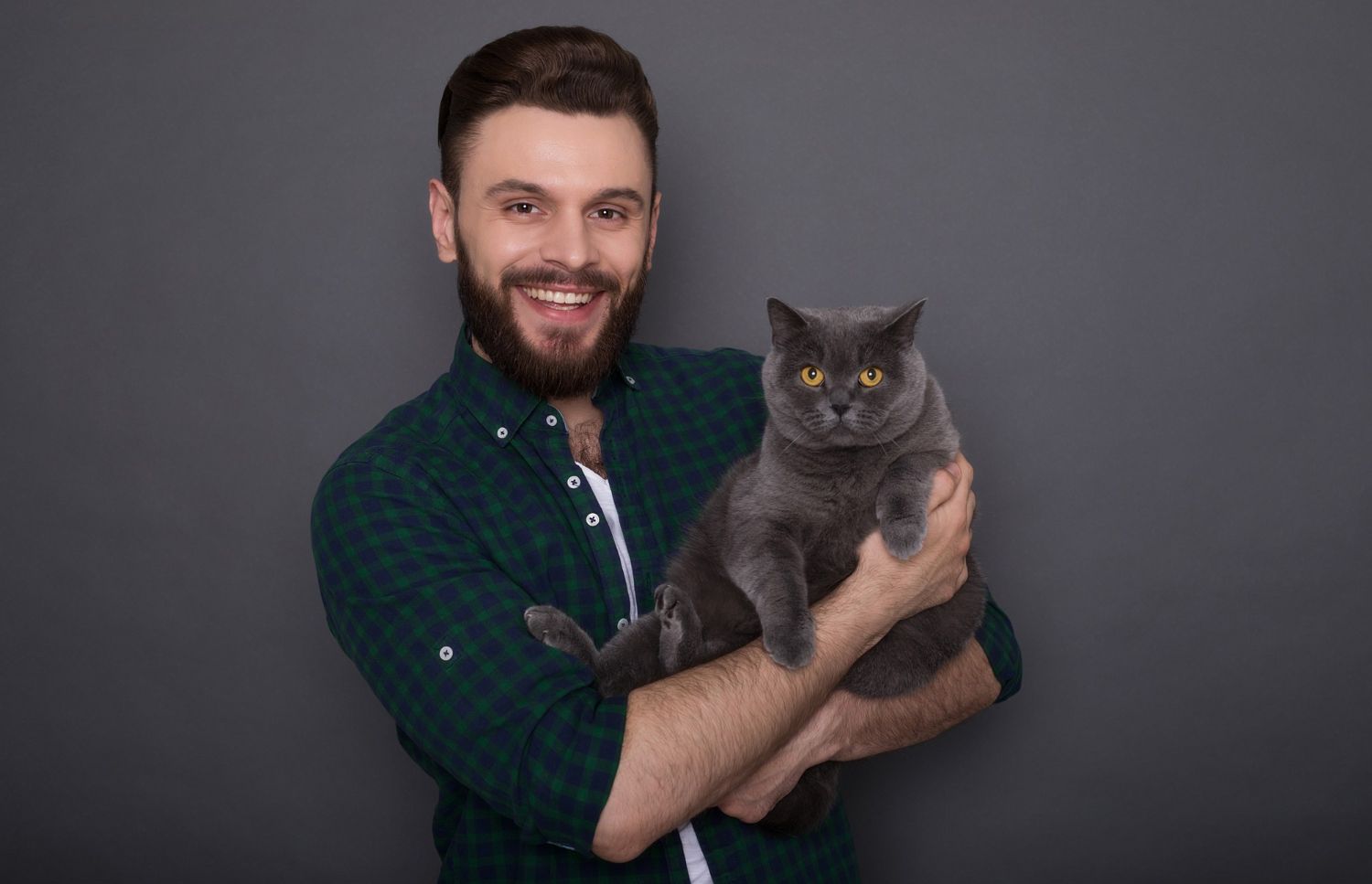 man holding white dog