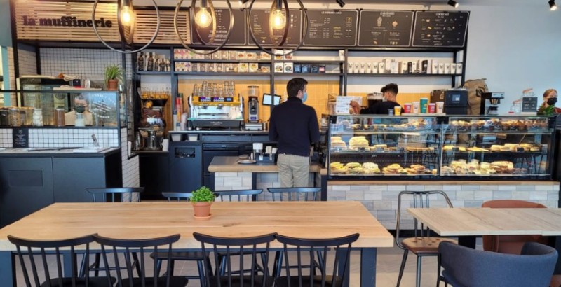 Fireworks illuminate the night sky above a city.