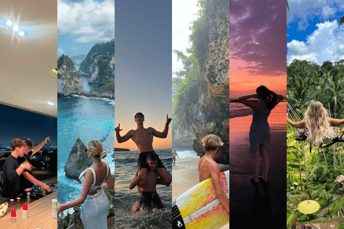 red train travelling near body of water