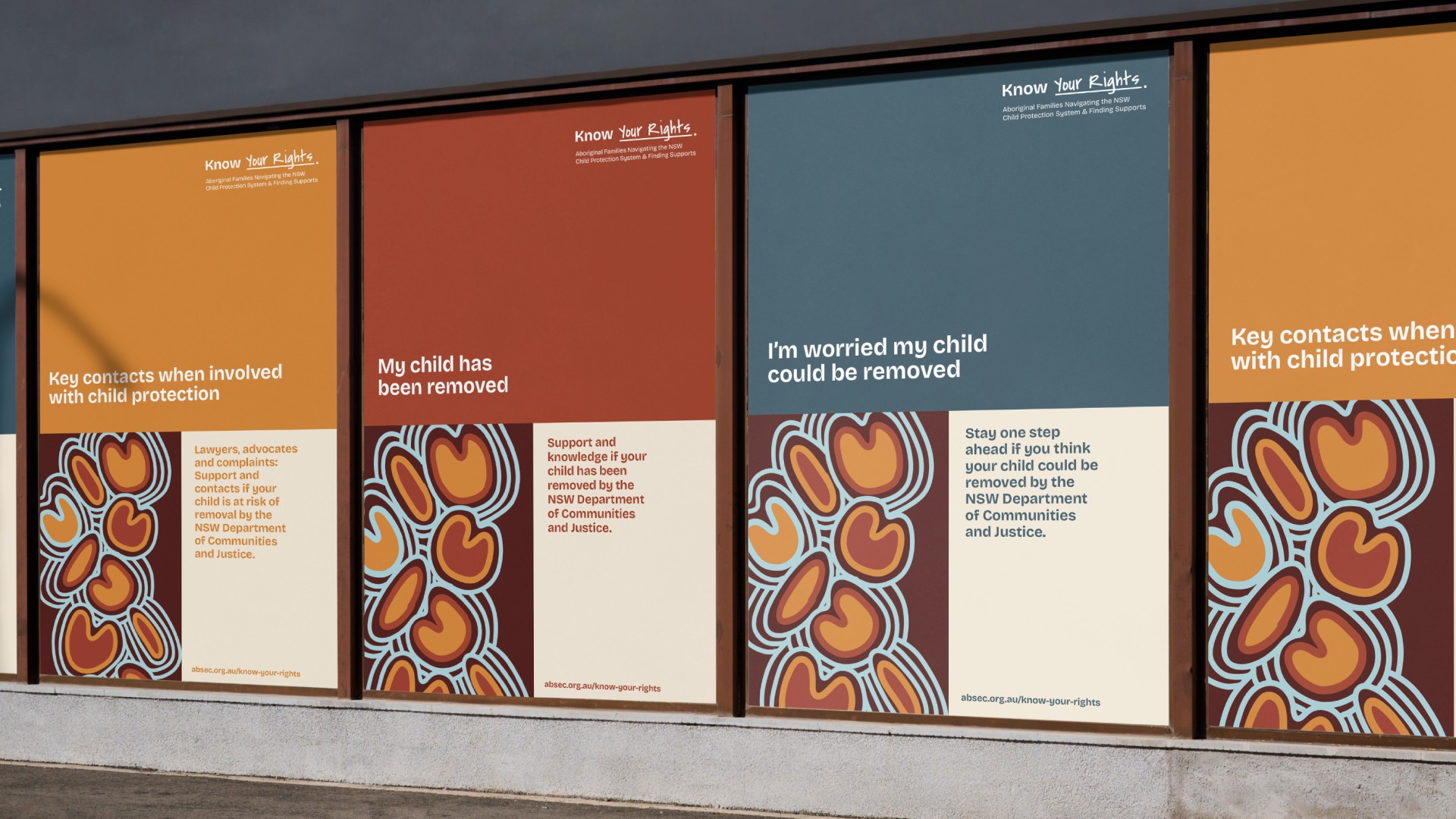 Modern home office setup with a monitor, ergonomic chair, keyboard, and indoor plants near a window with blinds.
