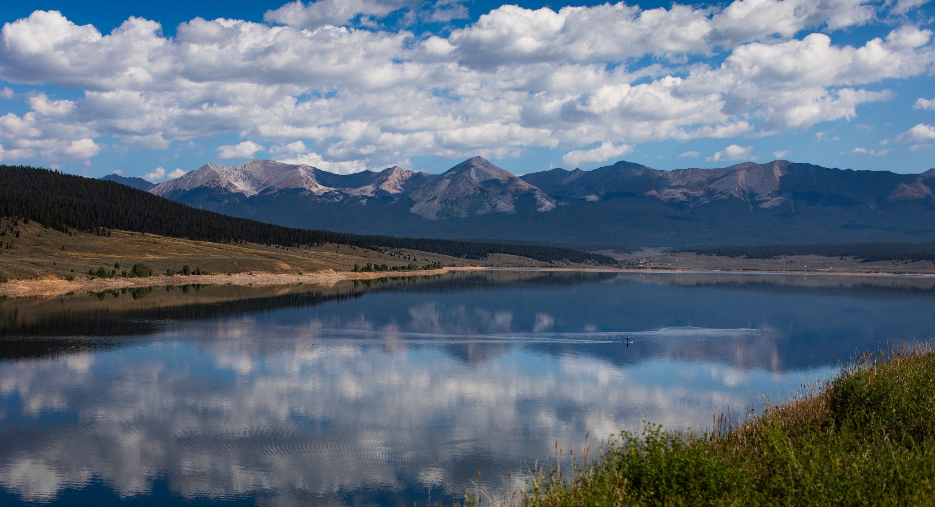 landscape photograph of mountains, water, desert, or coast by Lucas Jensen