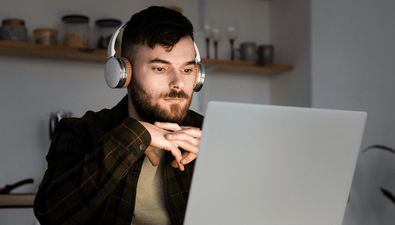 A man works on a laptop