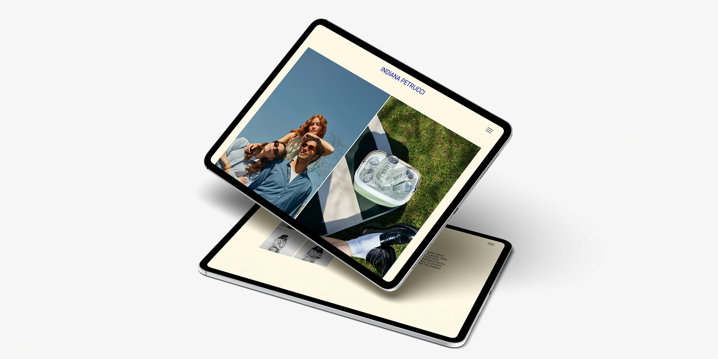 A digital presentation showcasing a sleek portfolio layout on two tablets, featuring a smiling couple outdoors and a close-up of a portable fridge with beverages, highlights the creativity and style available on a photographer's website.