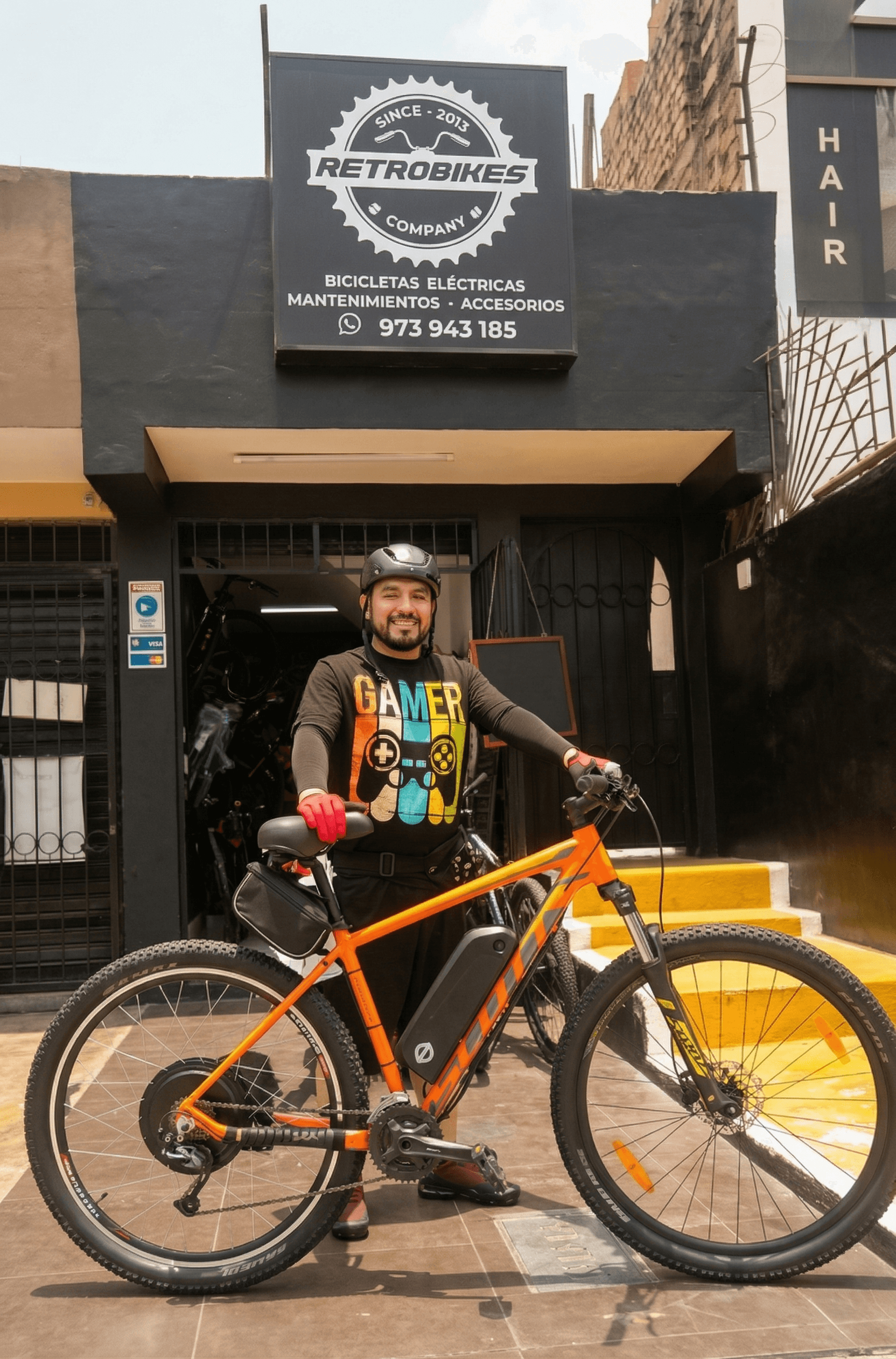  A man in a gym looking down at his phone, holding a water bottle. Quote: “I used to dread working out. Now it’s the best part of my day…” – Software Engineer.
