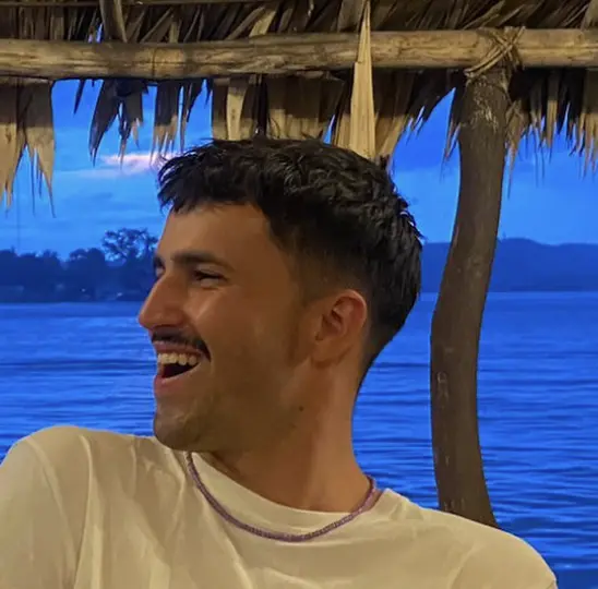 man in white crew neck shirt wearing black framed eyeglasses